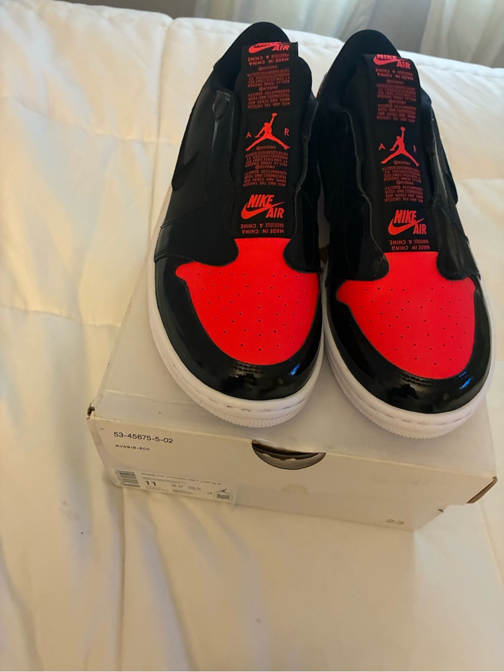Jordan Women’s Slip-On Sneakers in Black & Bright Crimson Patent